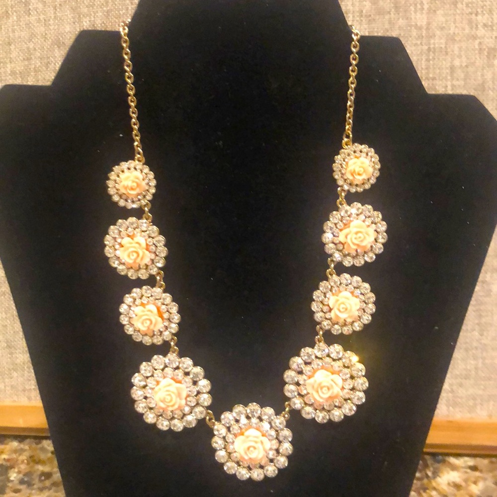 Stunning rhinestone statement necklace with pink roses.